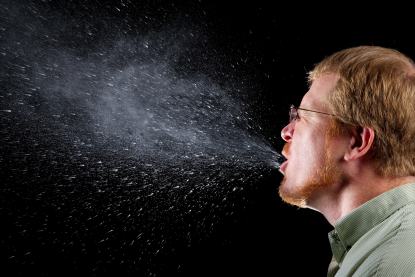 Photograph captured a sneeze in progress revealing the plume of
